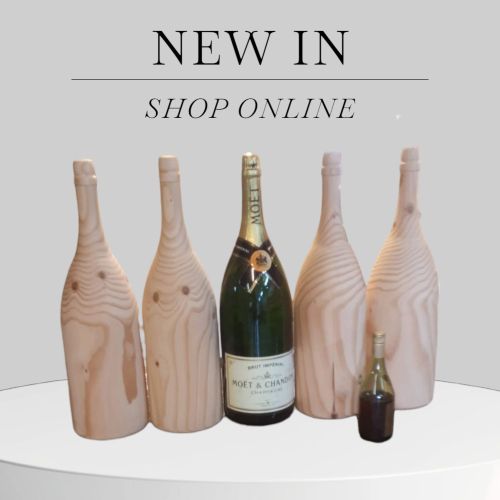 Houtdraaiwerk op maat voor winkelinterieur door www.houtdraaien.nl champagne flessen